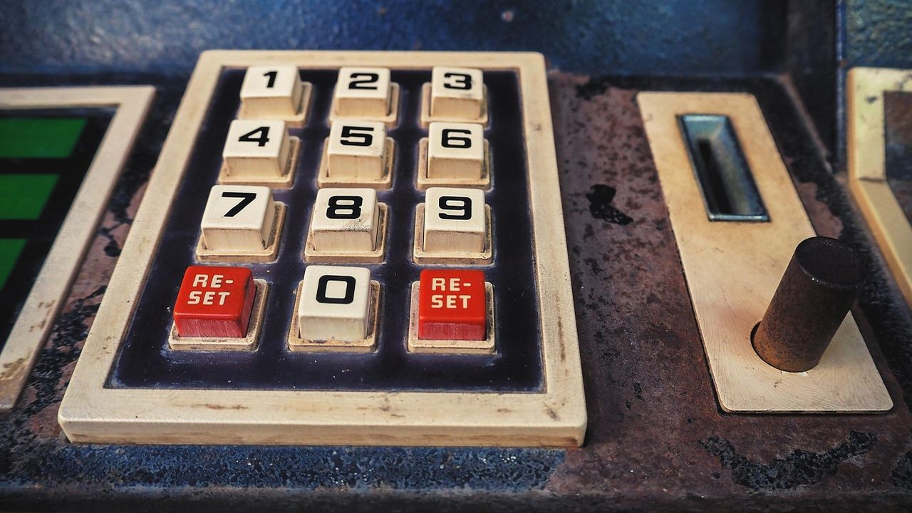 Vintage arcade machine keypad with numbered buttons