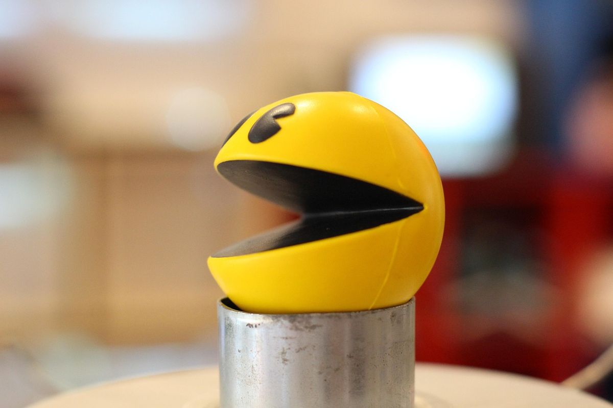 Yellow Pac-Man figure with an open mouth