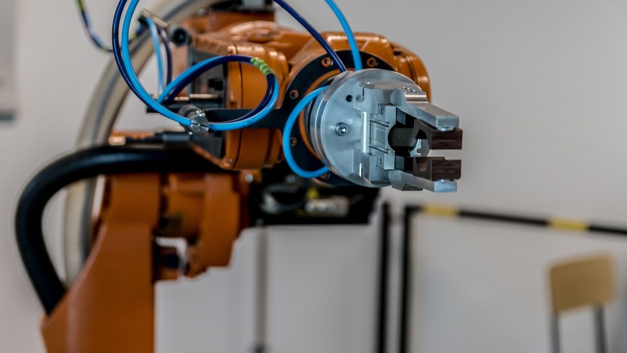 Industrial robot arm with a gripper