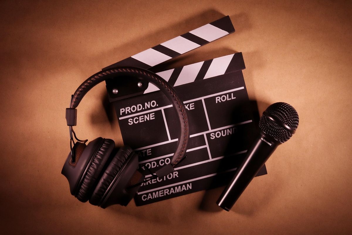 Headphones, microphone and film clapperboard