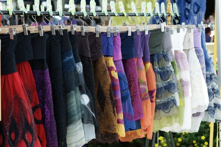 Rail of colourful summer skirts at a market stall