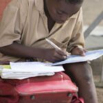 Child doing homework at a table