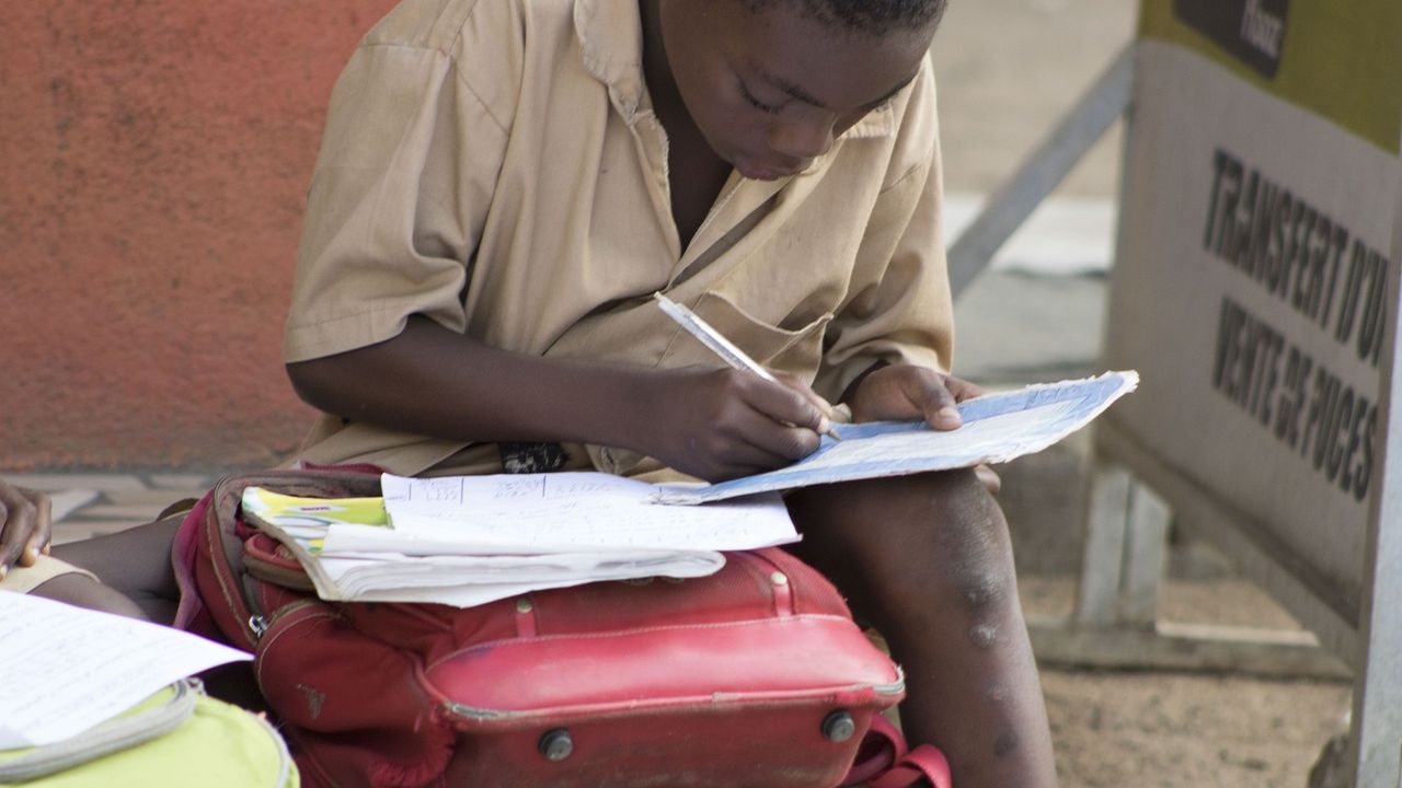 Child doing homework at a table