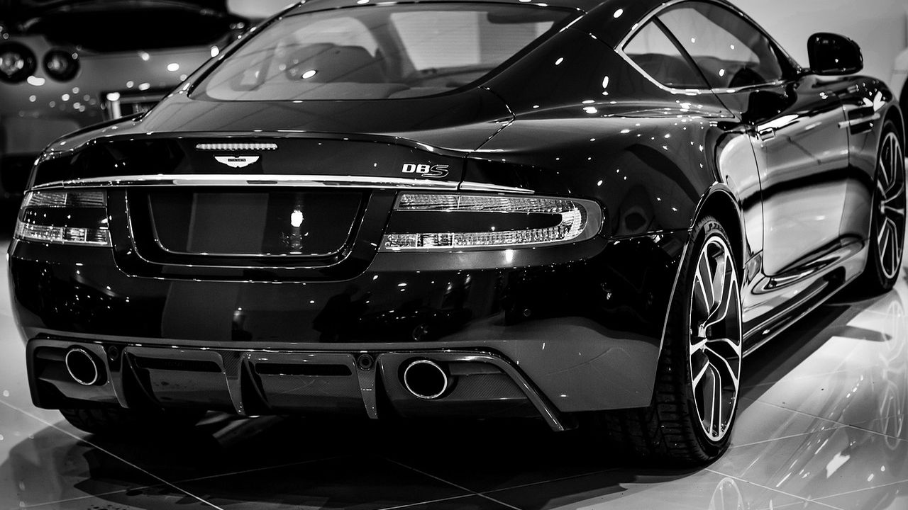 Black British grand tourer sports car