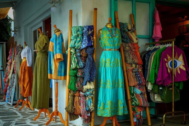 Colourful dresses and fabrics in a small clothing boutique