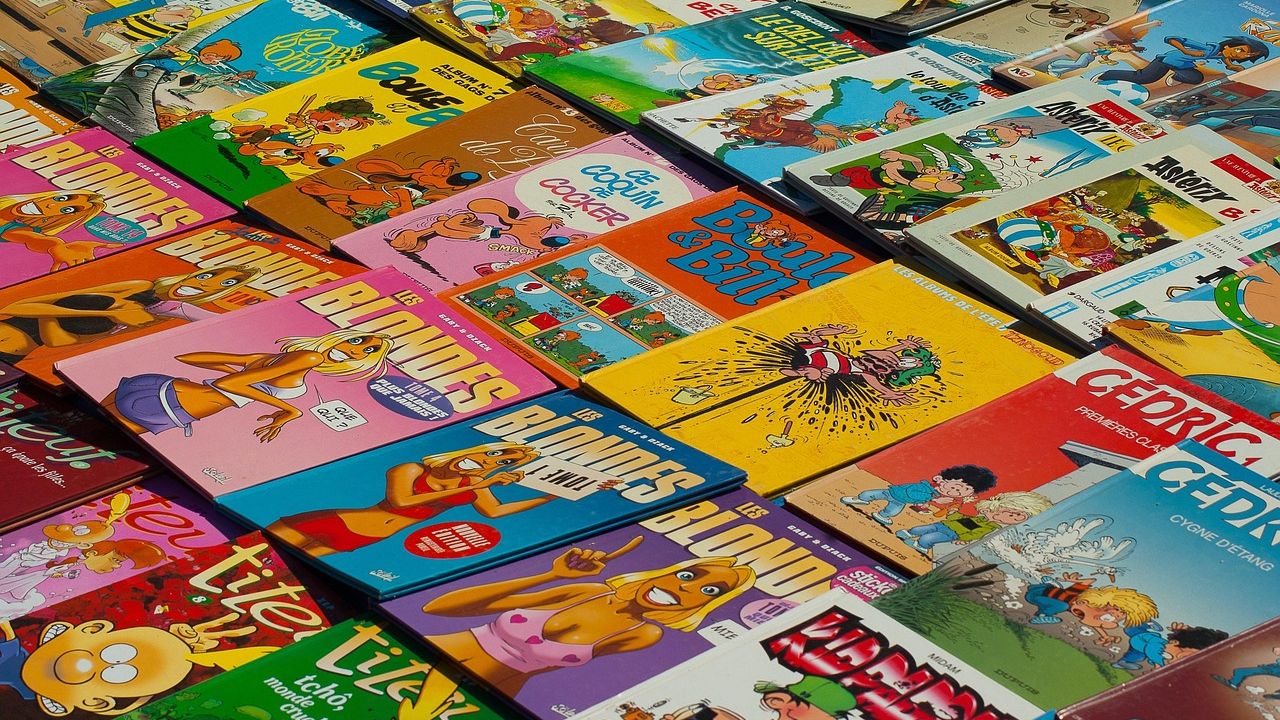 Colourful comic books spread out in overlapping piles
