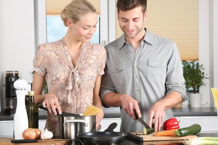 Happy valentines day, woman, man, kitchen, food preparation, couple, relationship, together, cooking, pair, cutting, chopping, everyday life, blonde, cutting board, vegetables, happy couple, stove, cook, knife, noodles