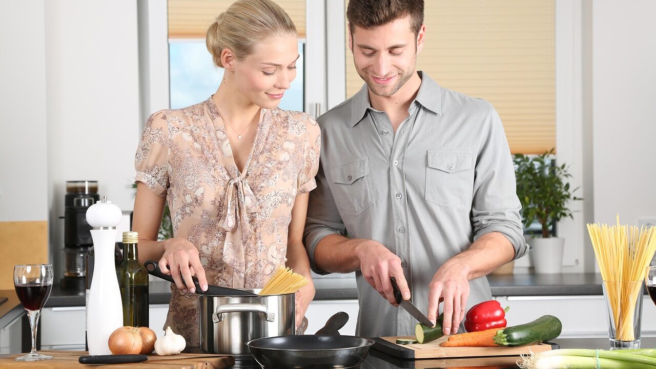Happy valentines day, woman, man, kitchen, food preparation, couple, relationship, together, cooking, pair, cutting, chopping, everyday life, blonde, cutting board, vegetables, happy couple, stove, cook, knife, noodles