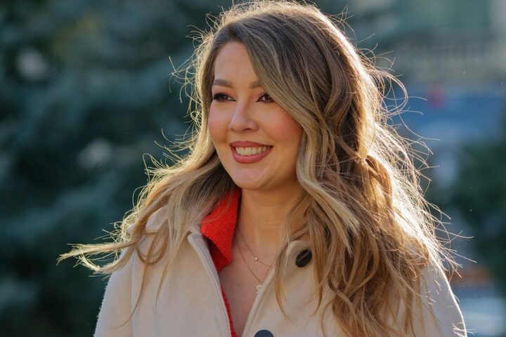 Smiling woman with long hair outdoors