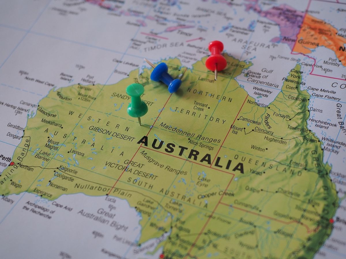 Coloured pins marking places on a map of Australia
