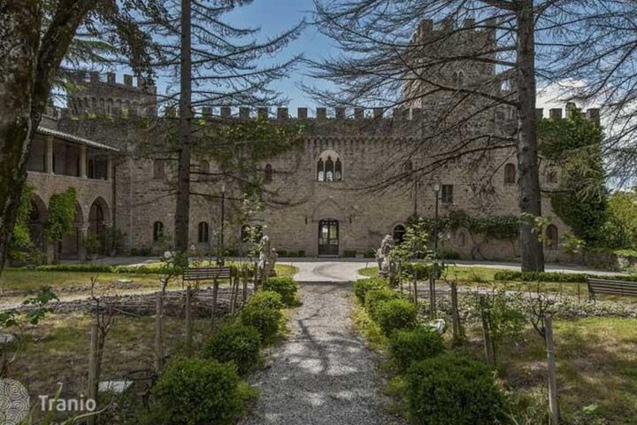 Fourteenth-century castle and garden path on an Umbrian estate
