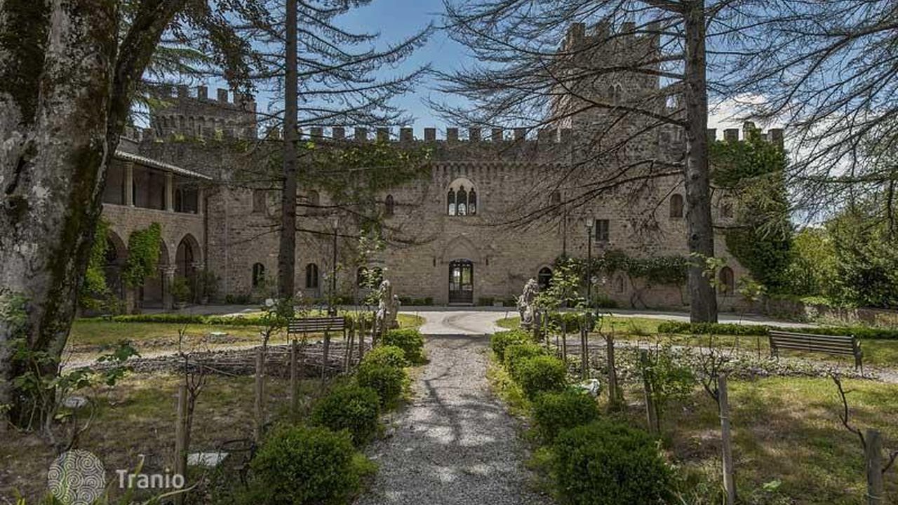 Fourteenth-century castle and garden path on an Umbrian estate