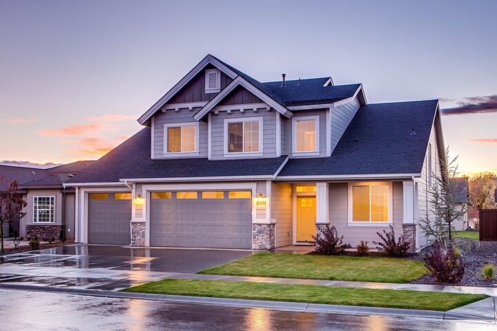 Suburban family house lit up at dusk