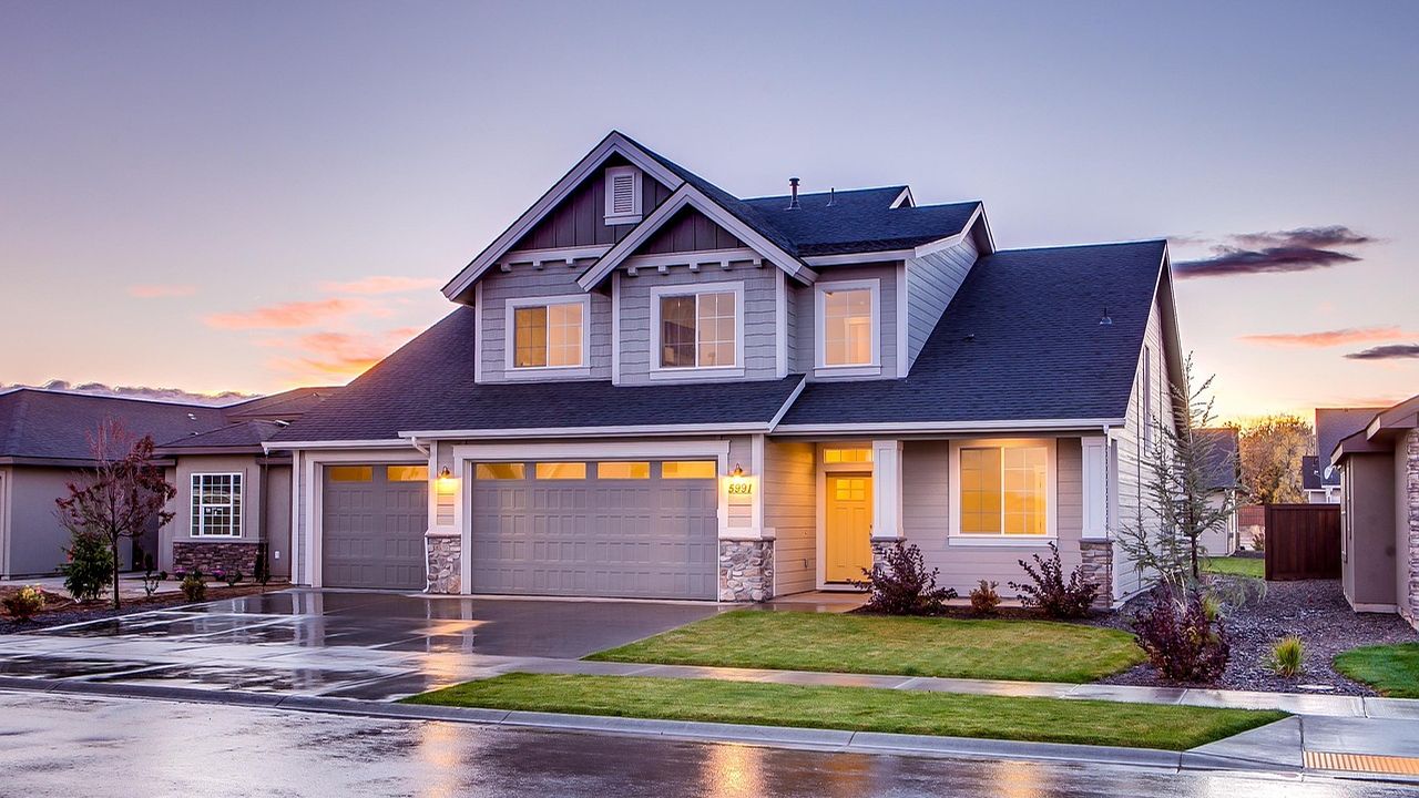 Suburban family house lit up at dusk