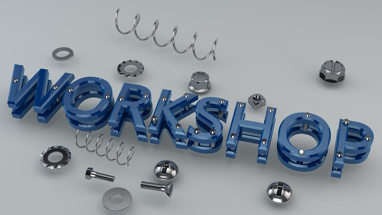 3D lettering spelling Workshop surrounded by nuts and bolts