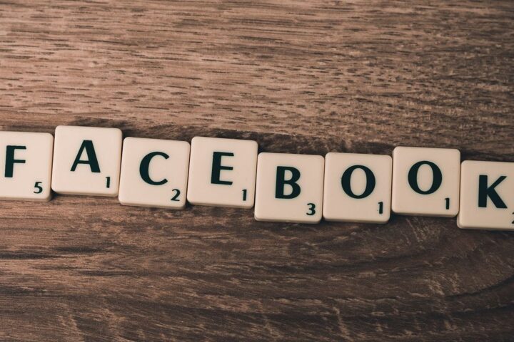 Scrabble tiles spelling Facebook on a wooden table