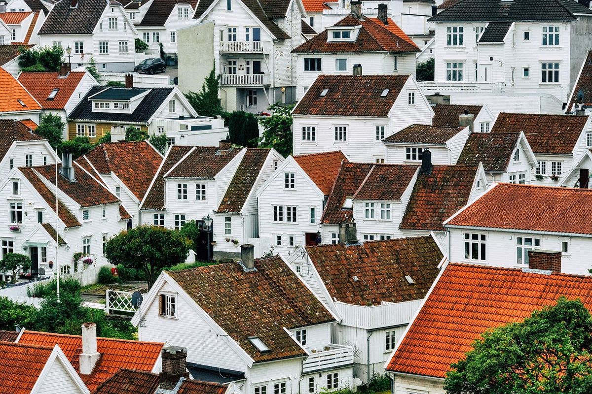 Hillside of white houses with red-tiled roofs