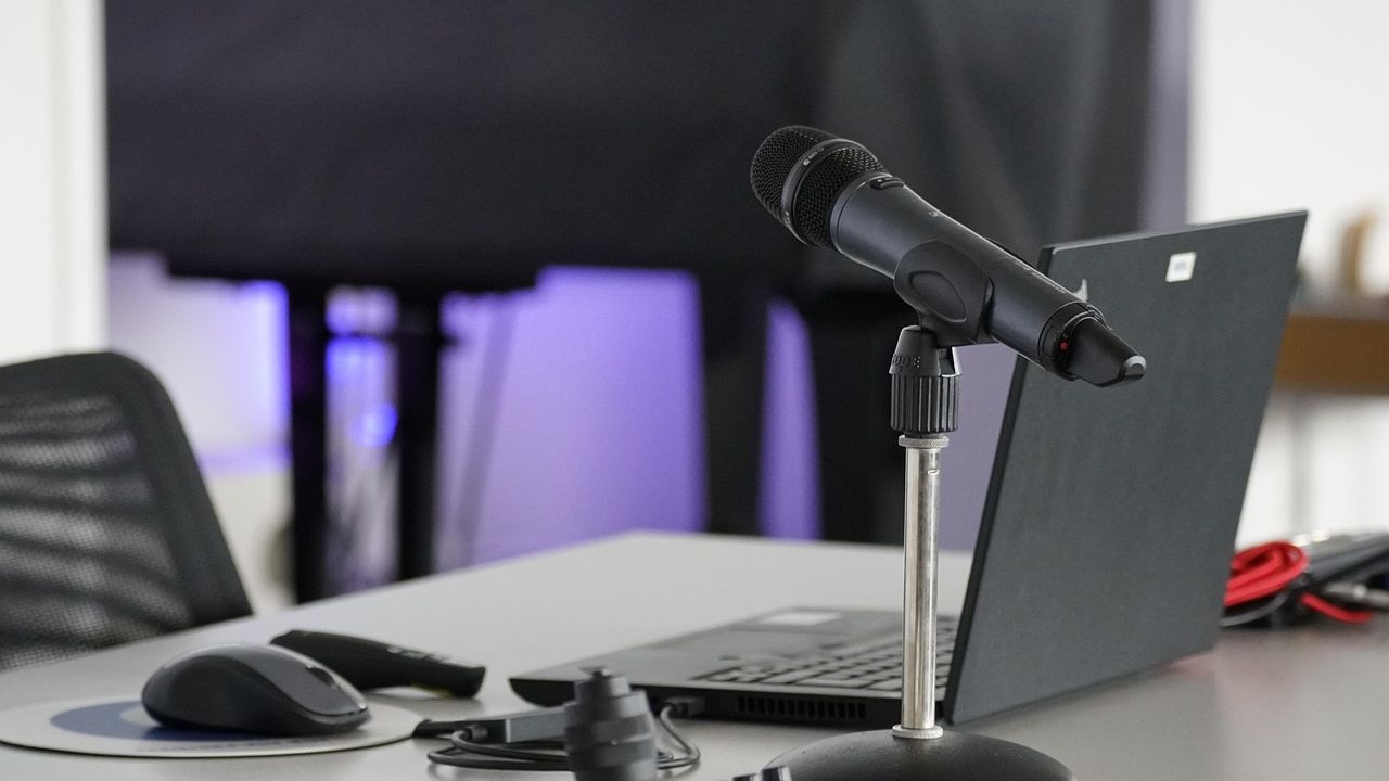 Microphone set up in front of a laptop for recording