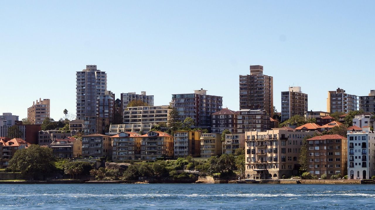 Sydney apartment towers along the harbour shoreline