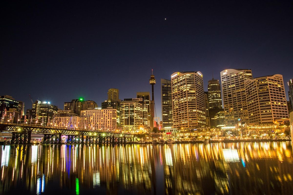 Sydney skyline lit up at night across the water