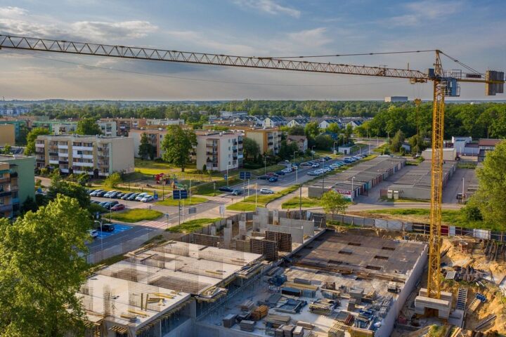 Construction site with a tower crane among apartment blocks