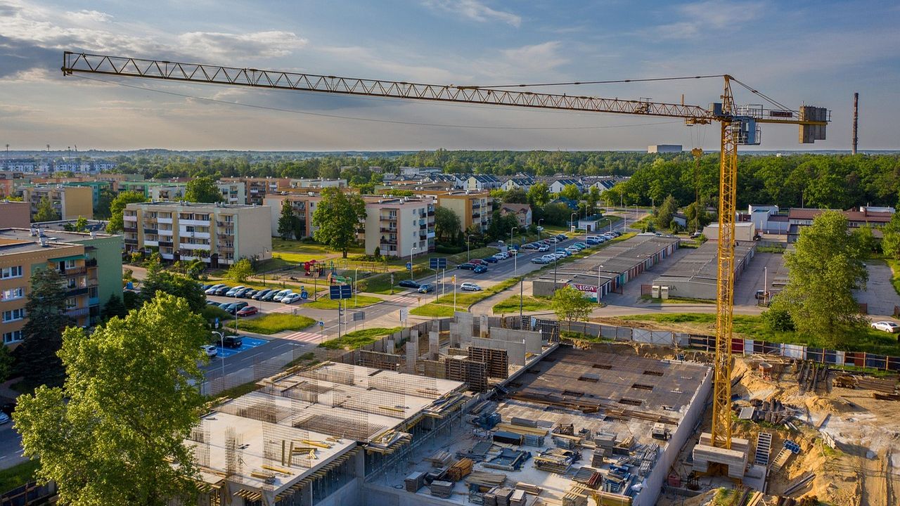 Construction site with a tower crane among apartment blocks