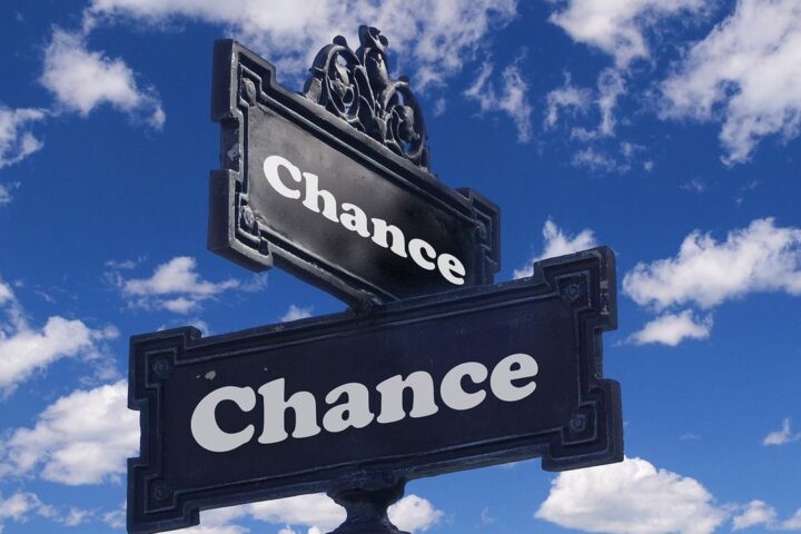 Ornate street sign reading Chance against a blue sky