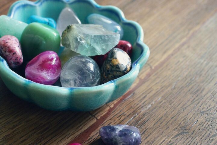 Bowl of polished healing crystals and gemstones