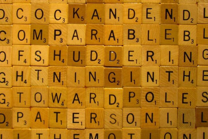 Wooden letter tiles forming a grid of words