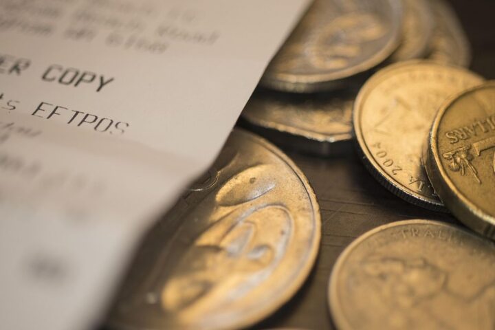 Coins on top of a till receipt
