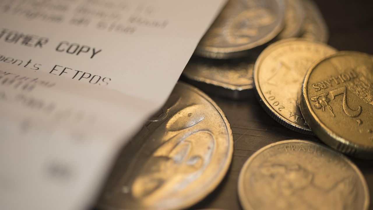 Coins on top of a till receipt