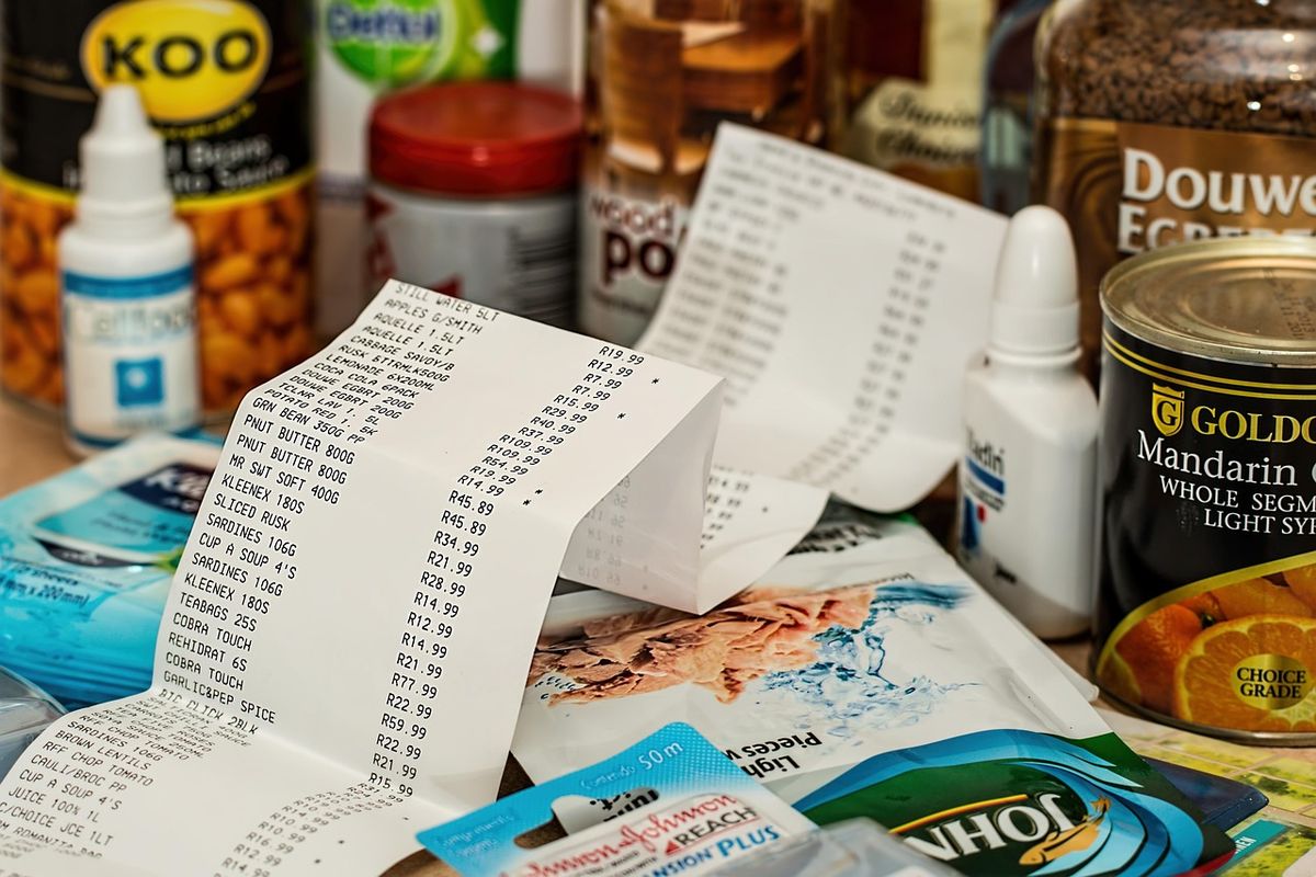 Long shopping receipt among grocery items