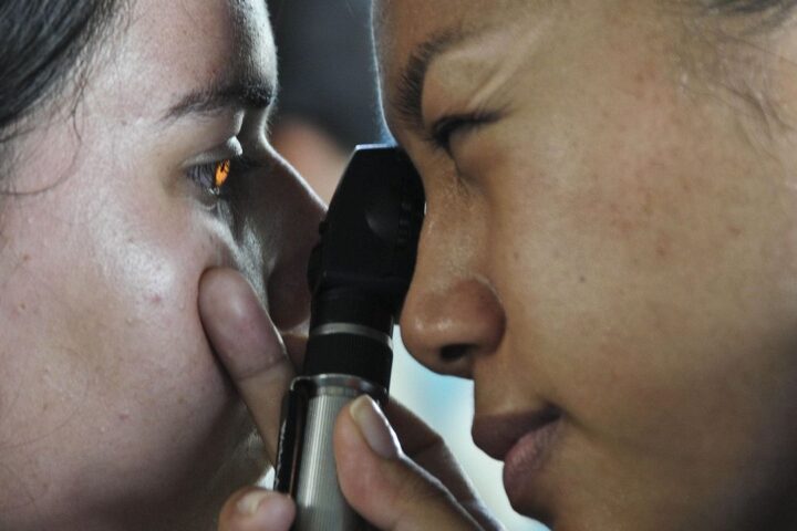 Optometrist examining a patient's eye
