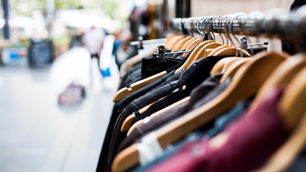 Row of clothes hanging on a shop rail