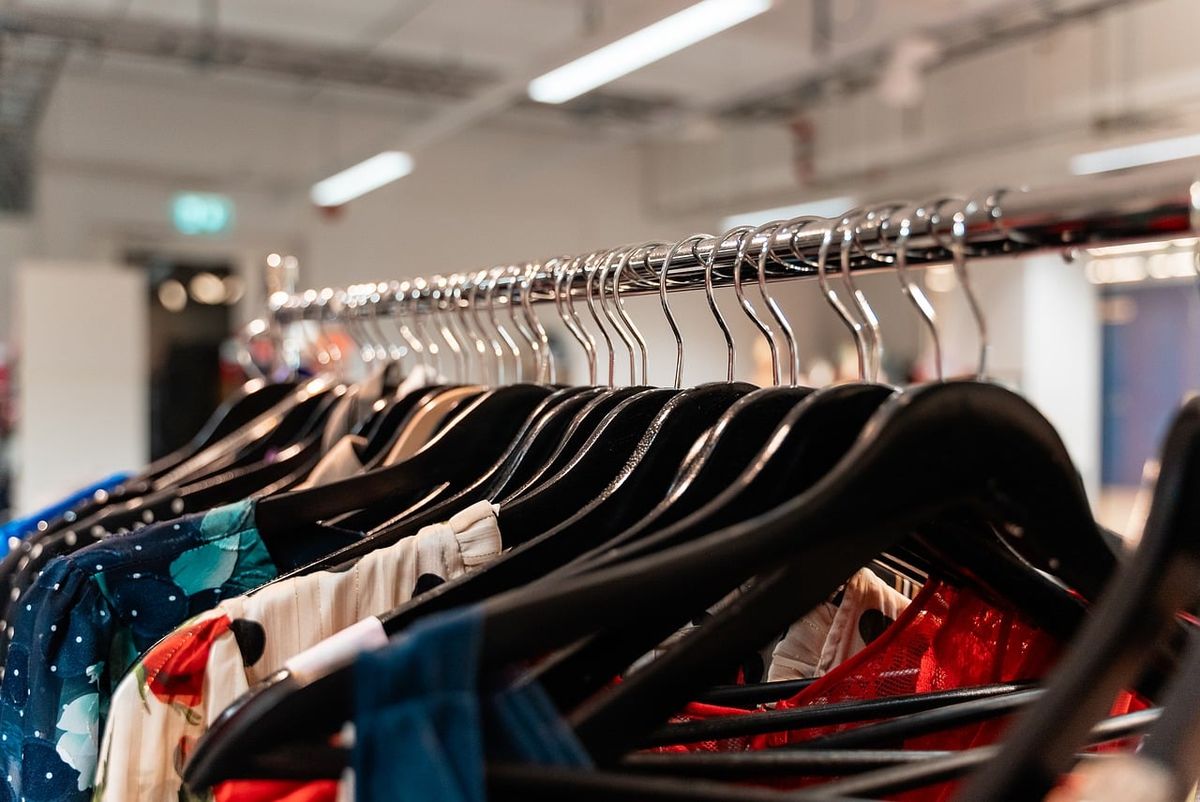 Clothing rack in a bright, empty store