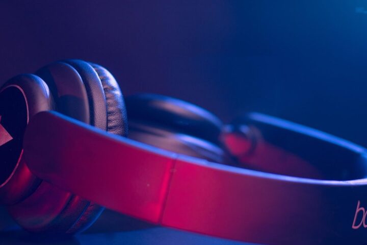 Pink headphones in blue light