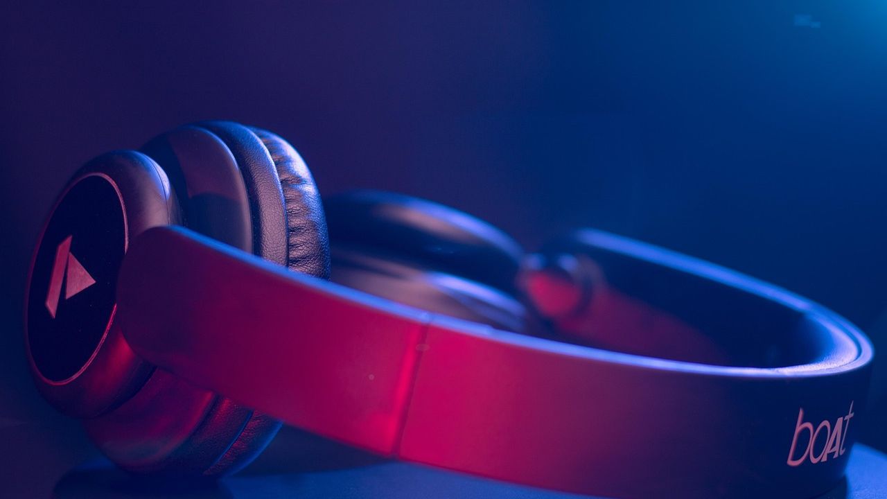 Pink headphones in blue light