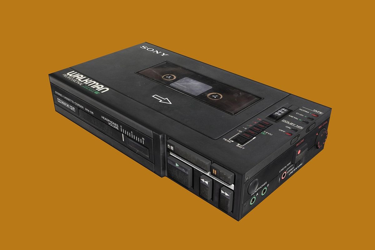 Retro cassette player on an orange background