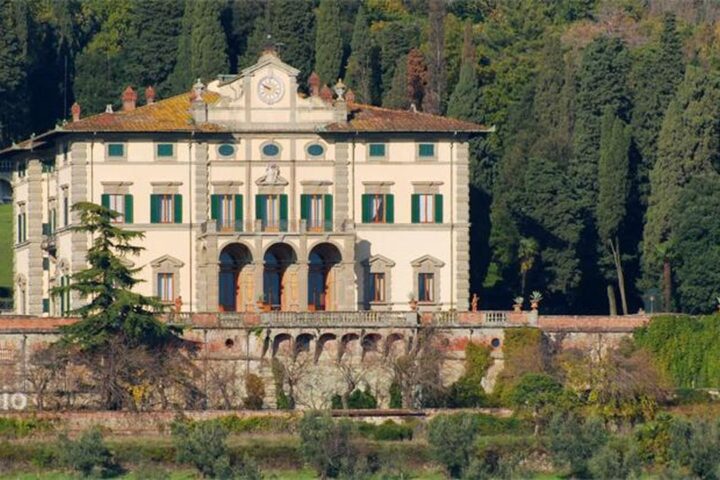 Nineteenth-century Tuscan villa set against wooded hills