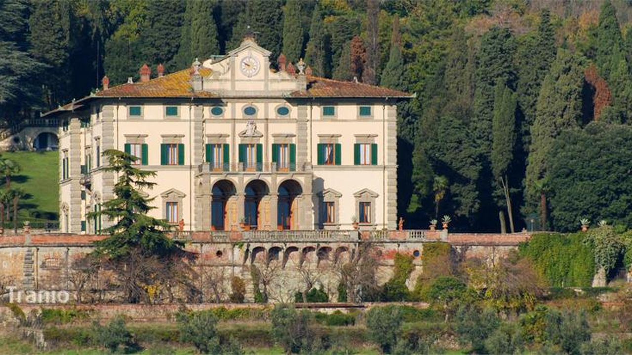 Nineteenth-century Tuscan villa set against wooded hills
