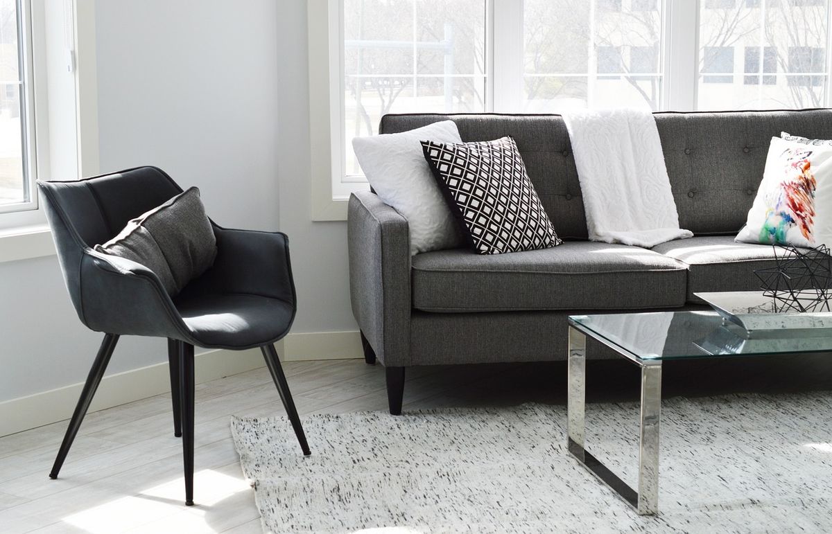 Modern living room with grey sofa and armchair
