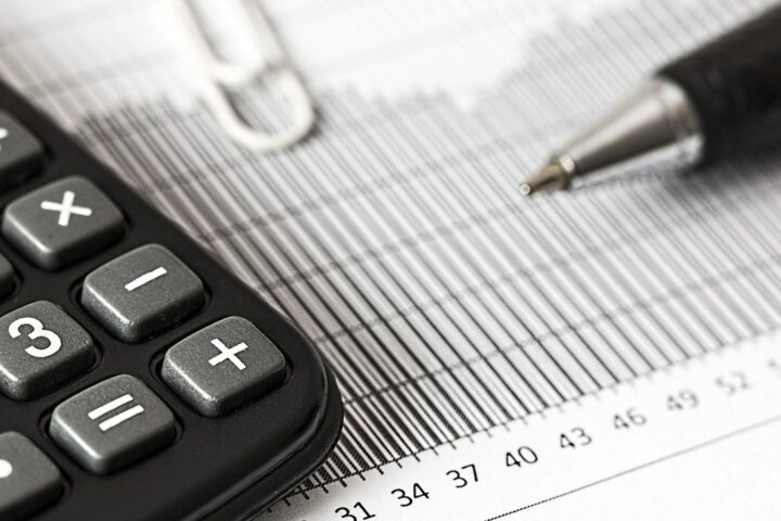 Calculator, pen and printed figures