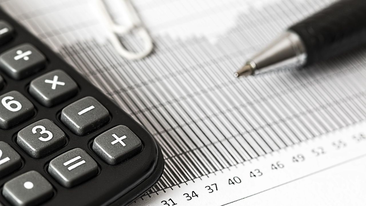 Calculator, pen and printed figures