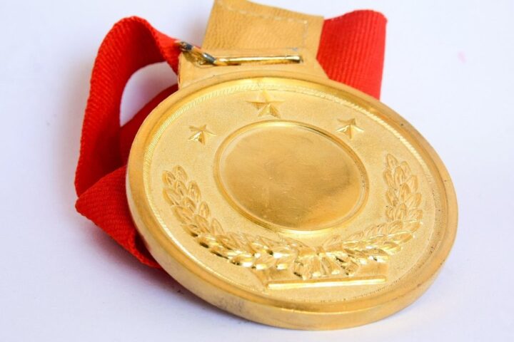 Gold medal with a red ribbon