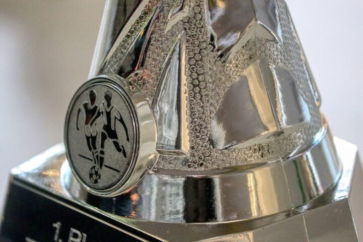 Close-up of a silver football trophy