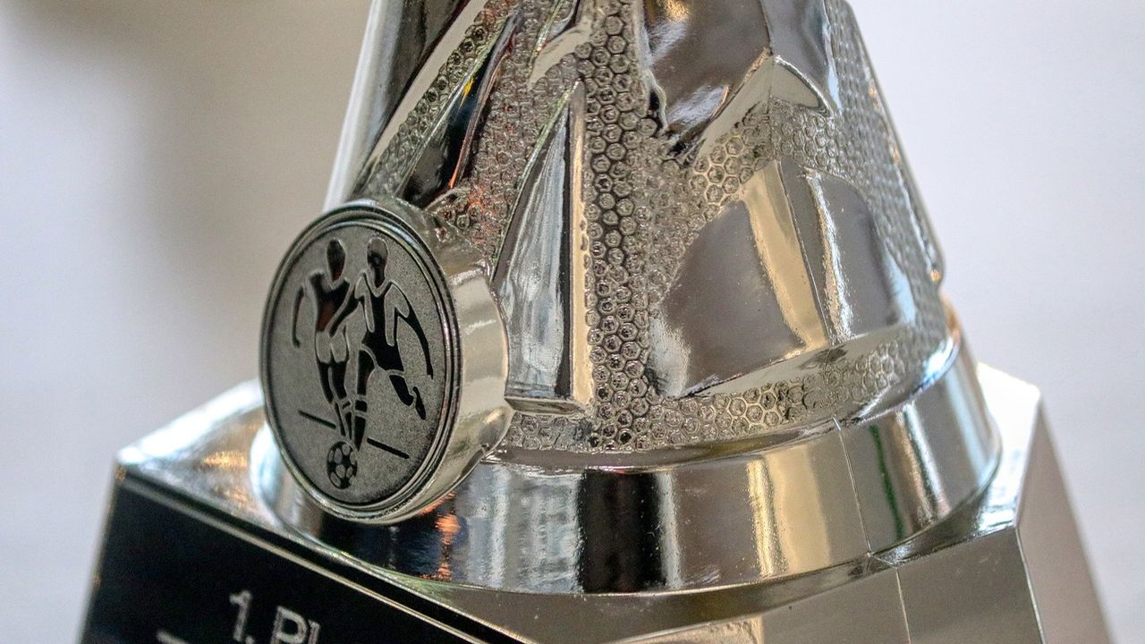 Close-up of a silver football trophy