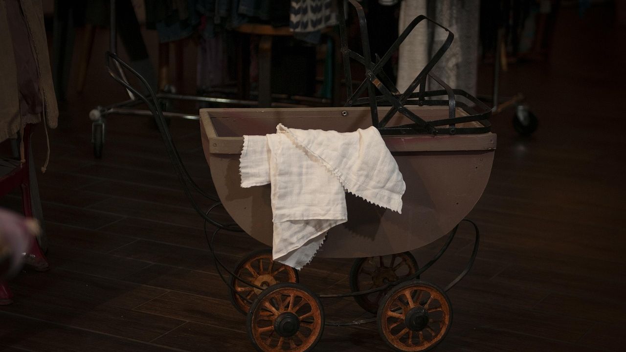 Vintage pram in a dimly lit room
