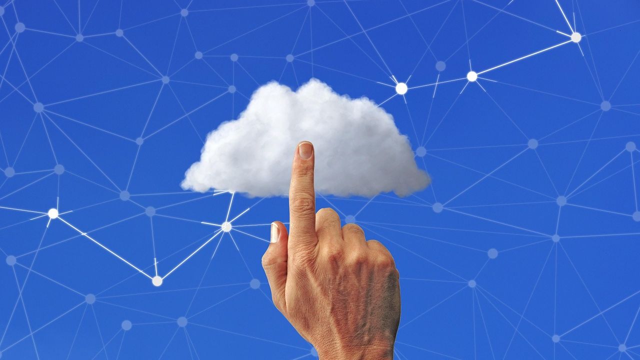 Finger touching a cloud linked to a digital network