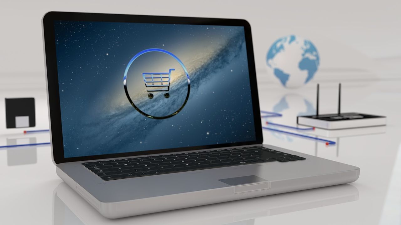 Laptop with a shopping cart icon and a globe
