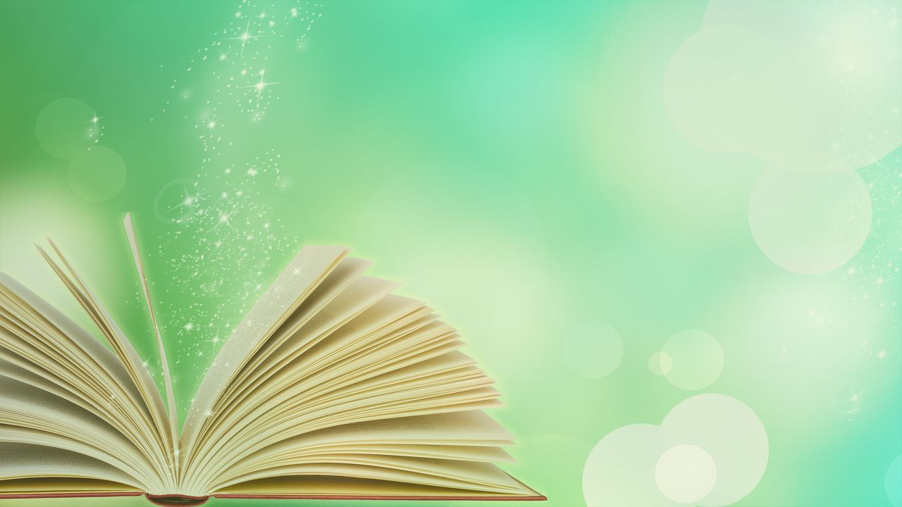 Open book with sparkles against a green background